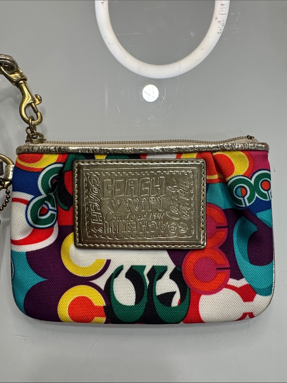 Coach Poppy Multicolor signature wristlet with gold accents and hangtag